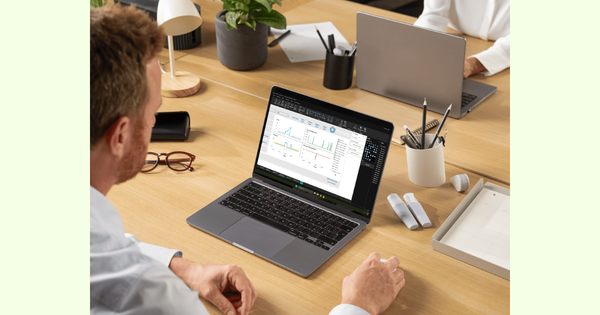 Power BI dashboard open on a laptop in an office
